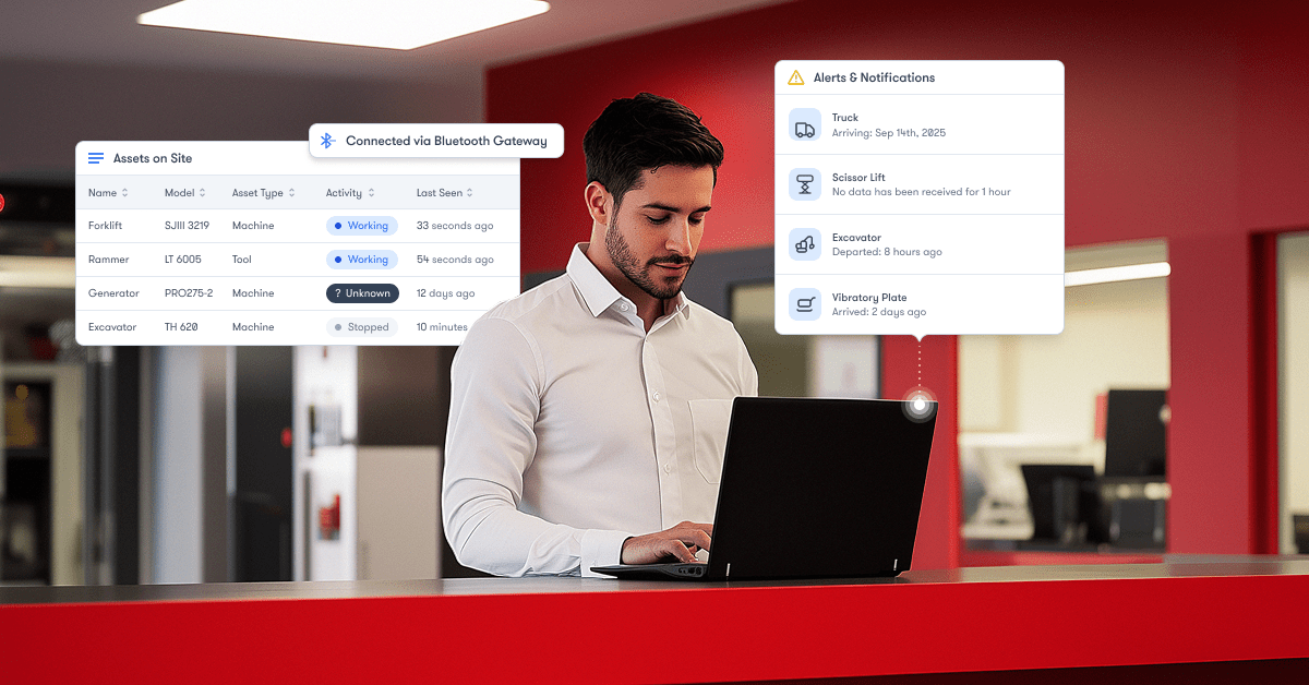 A man uses a laptop at a counter with digital graphics showing equipment status and alerts, illustrating construction IoT.