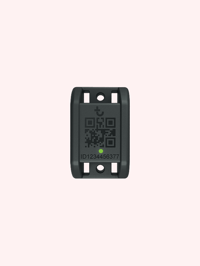 A small black device with a QR code, ID number, and icon, used for construction equipment tracking, on a pale background.