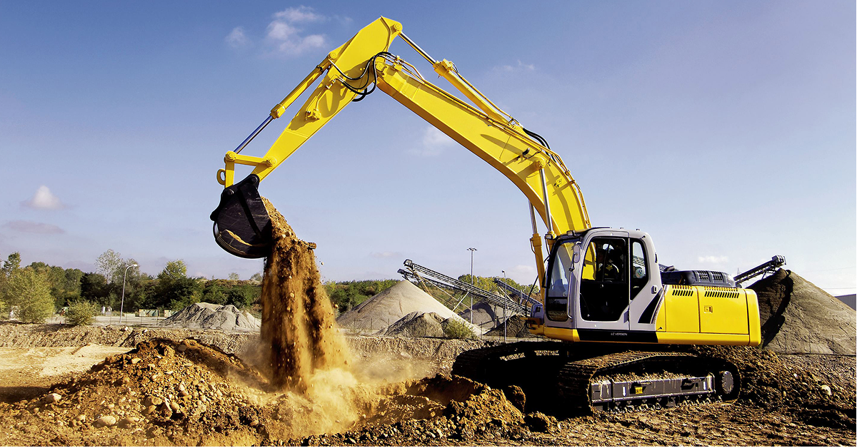 A yellow excavator with aftermarket parts moves dirt at a construction site, surrounded by equipment and earth under a blue sky.