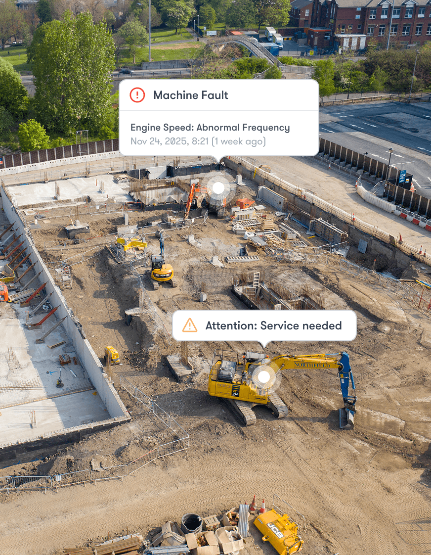 Aerial view of a construction site with excavators; digital alerts show machine faults and maintenance needs for connected jobsite.