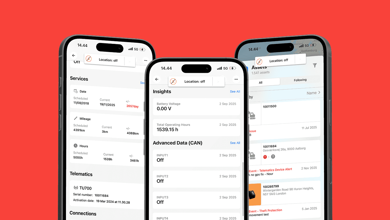 A group of cell phones displaying data, suggesting construction equipment tracking.