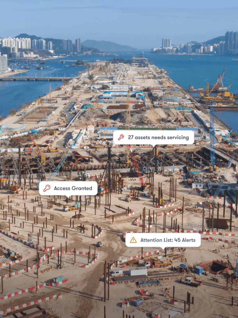 Aerial view of a construction site with cranes, water, service alerts, and access icons—showing connected jobsite activity.