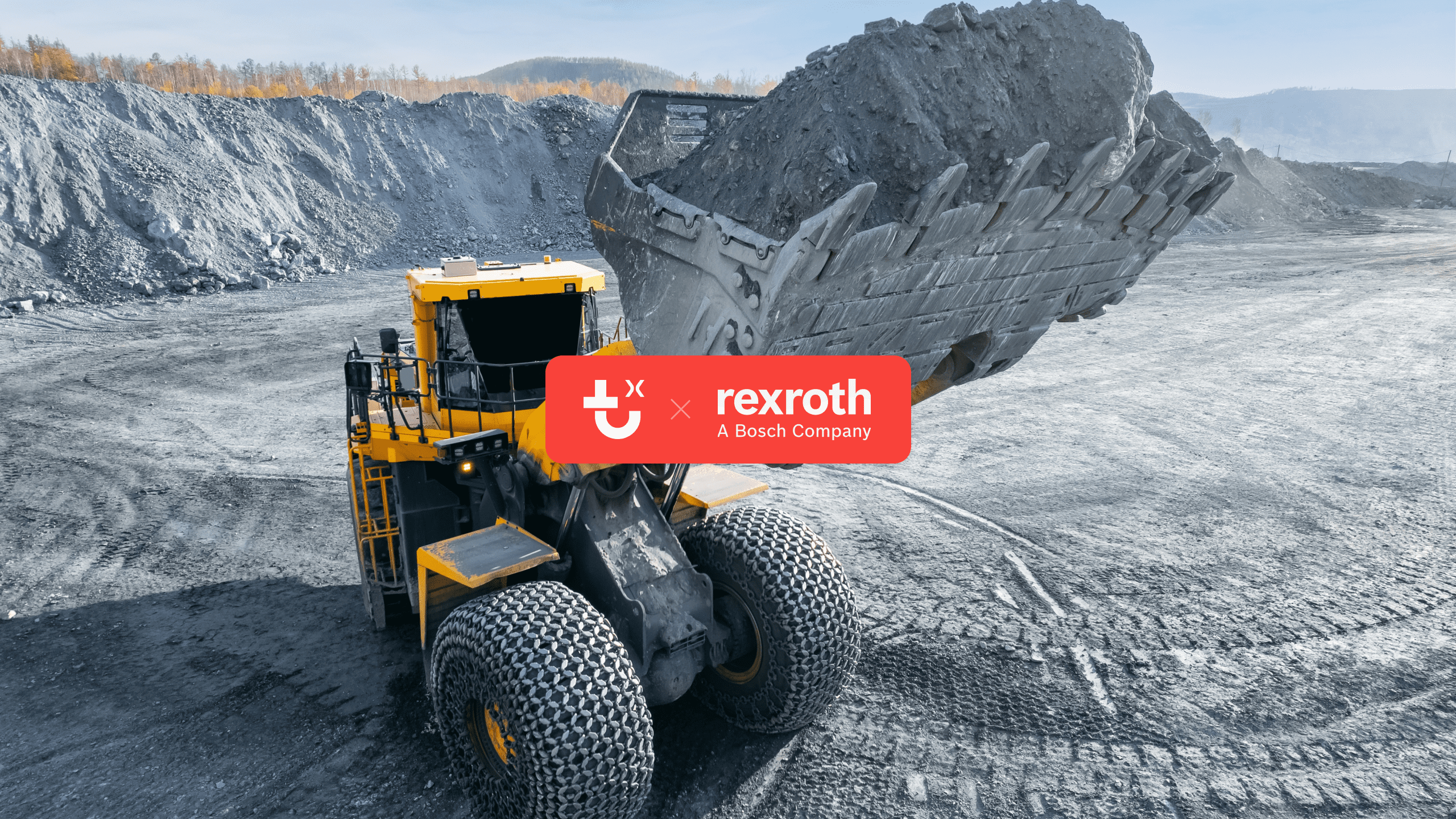 A large yellow wheel loader lifts dirt at a mining site, with rocky terrain, Rexroth logo, and Trackunit IrisX technology overlay.