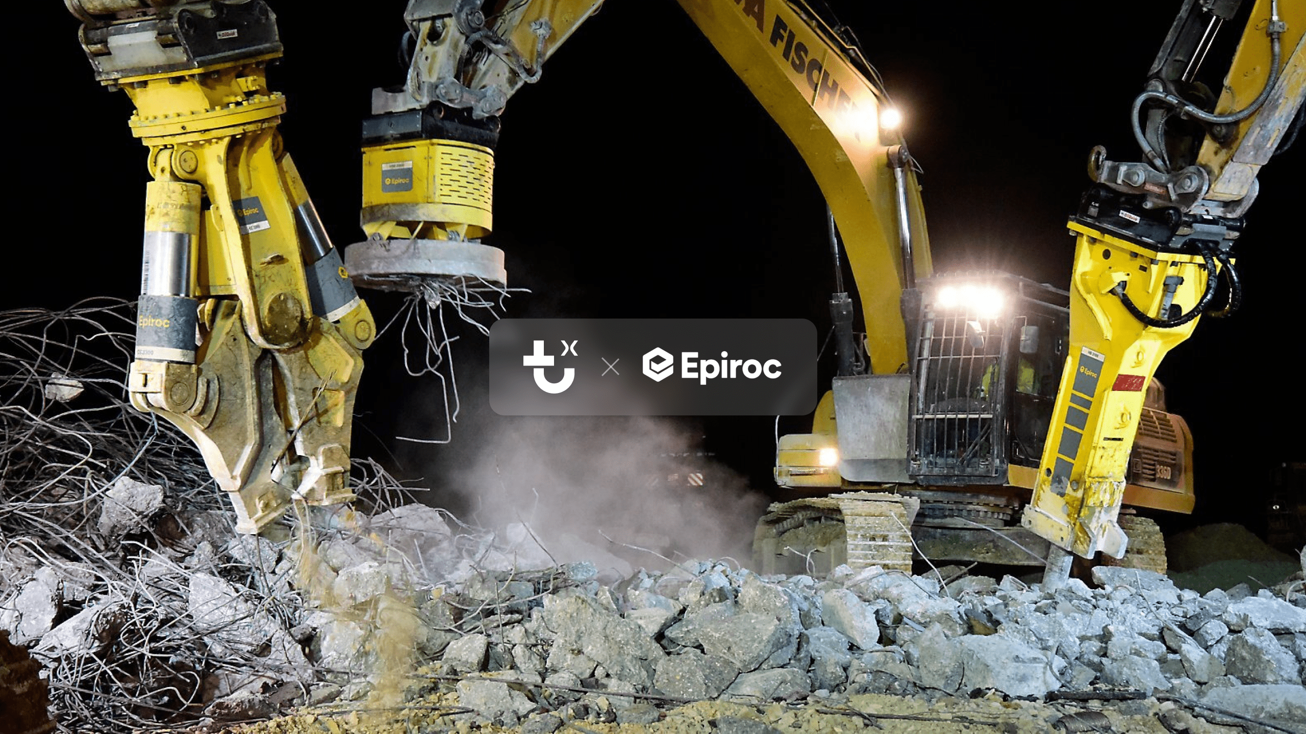 Two yellow-arm excavators break concrete rubble at night, with twisted rebar, dust, and Epiroc, Fiskarson, and IrisX branding visible.