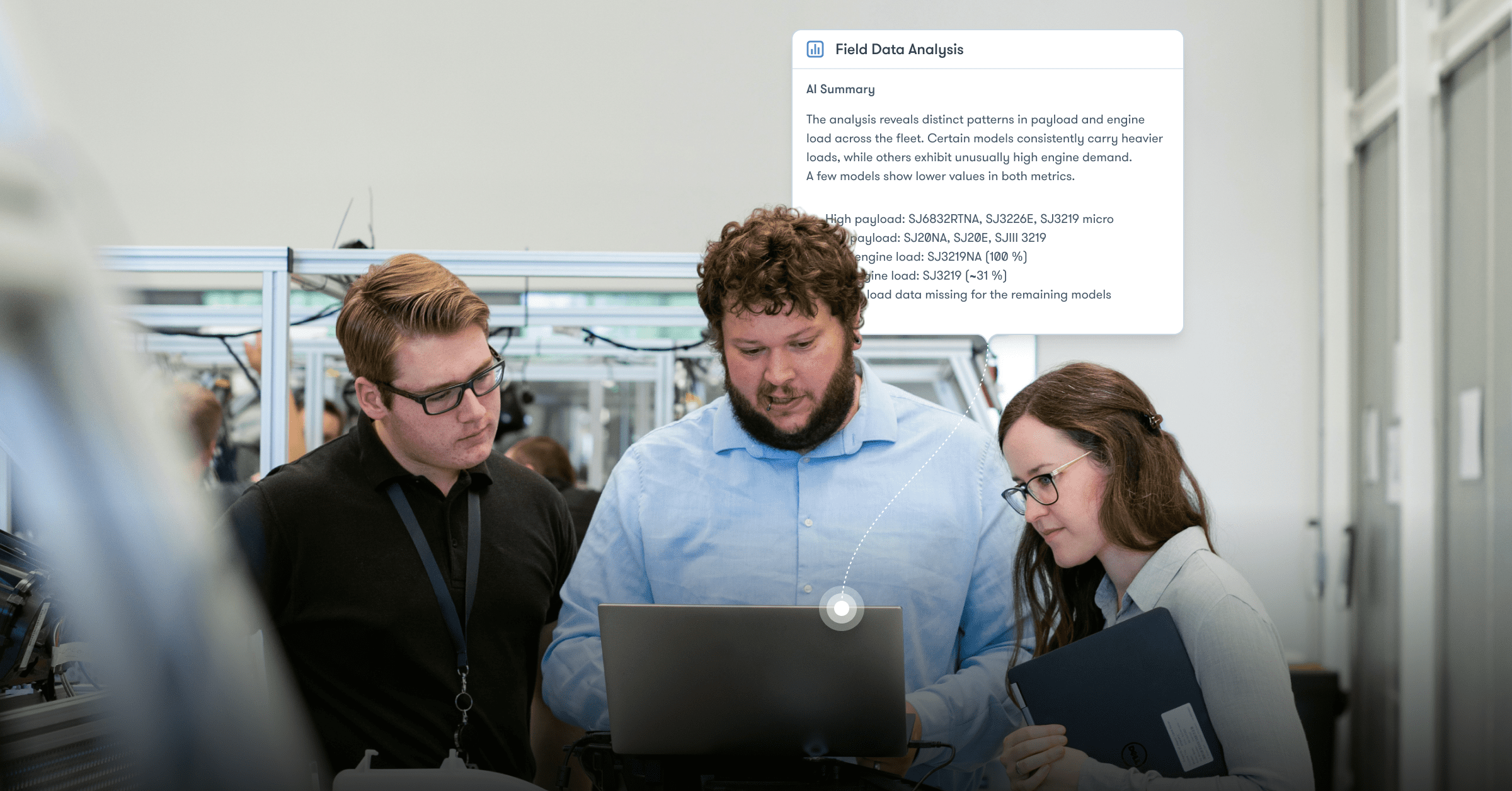 Three people discuss a laptop screen in a lab with equipment behind them and a digital overlay on field data analysis; construction IoT.