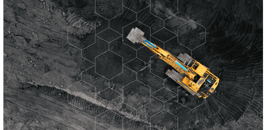 A yellow excavator digs into dark soil at a construction site, overlaid with a digital grid, highlighting connected jobsite efficiency.