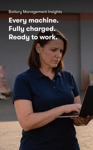 A woman in a navy polo uses a laptop outdoors. Text reads: Battery Management Insights. Fleet management, fully charged machines.