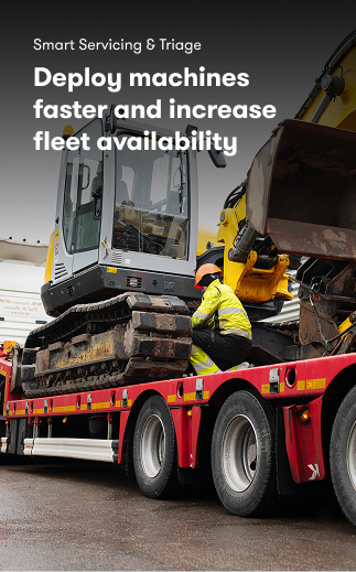A worker in a yellow safety jacket secures an excavator onto a red flatbed truck, highlighting fleet management and faster deployment.