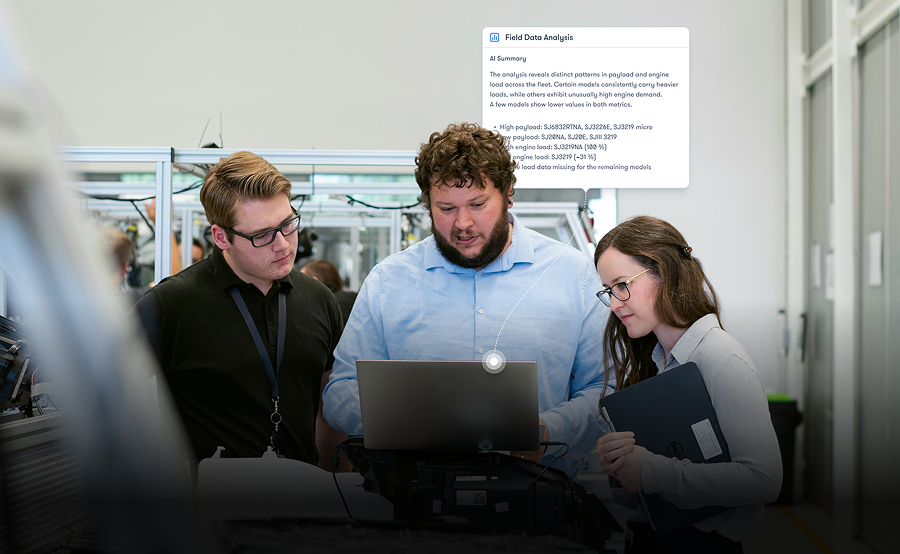 Three people in a modern office discuss data on a laptop, with a Field Data Analysis alert overlay—related to connected jobsite.