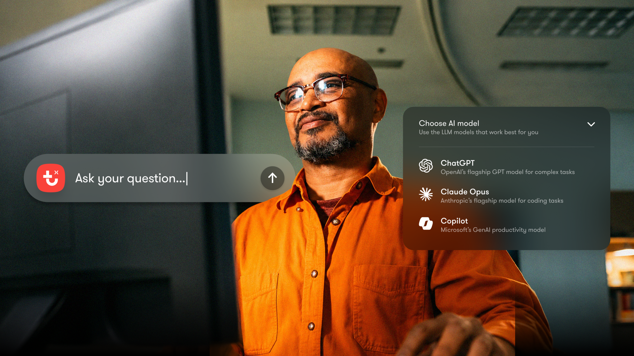 A man in glasses and an orange shirt reviews a floating interface with AI options for analyzing MCP fleet data in a fleet management office.