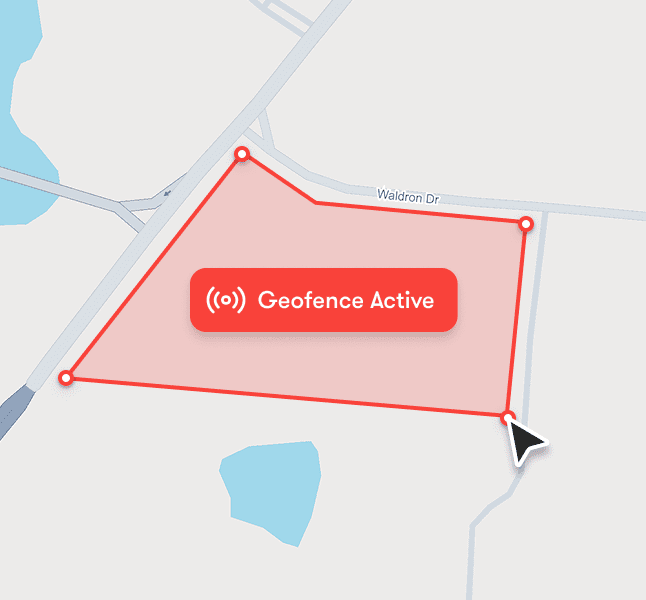A digital map with a red geofence labeled Geofence Active and a cursor on Waldron Dr, for construction equipment tracking. Blue water nearby.