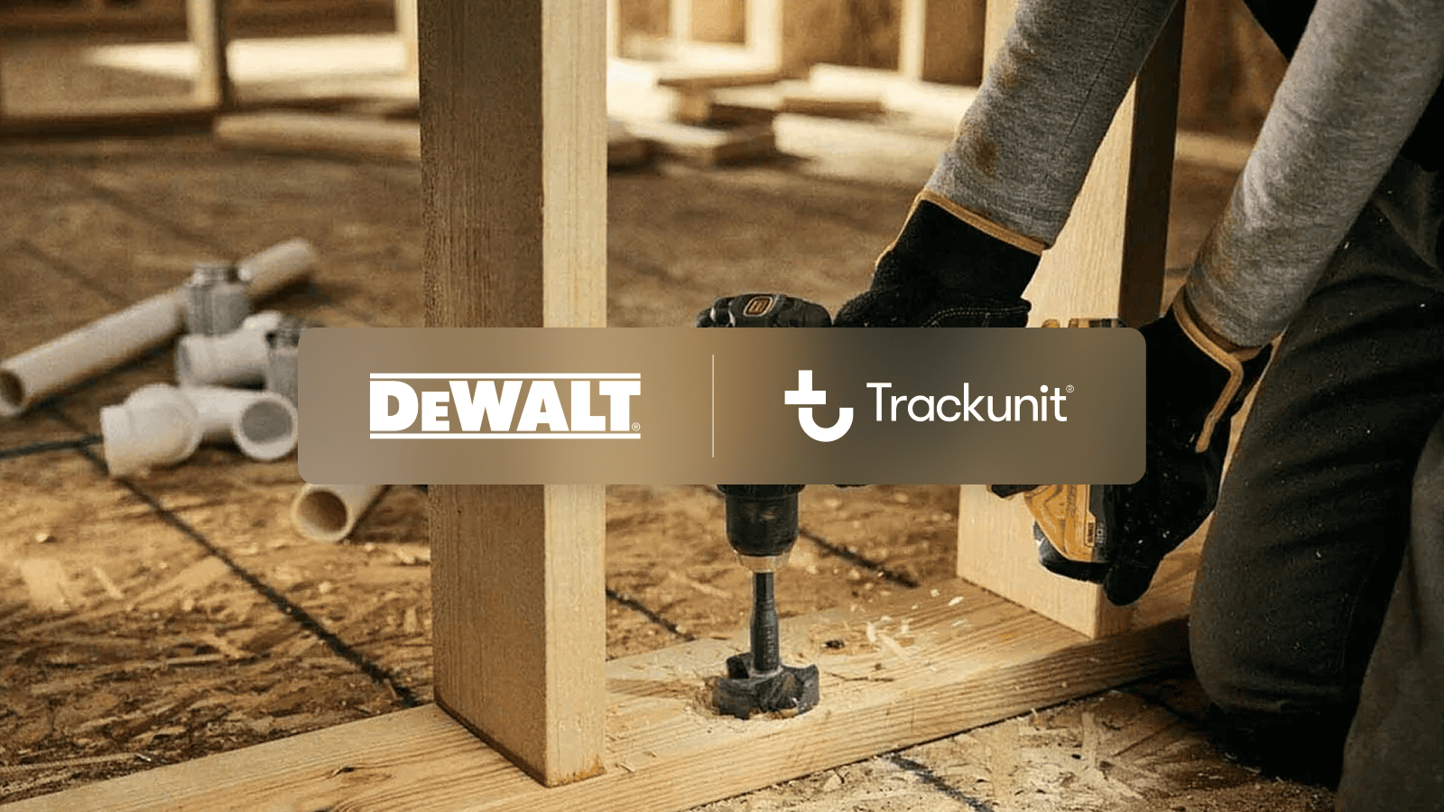 A person uses a DeWalt power drill on a wooden frame, with DeWalt and Trackunit IrisX MCP logos overlaid in the center. Construction materials are visible in the background.