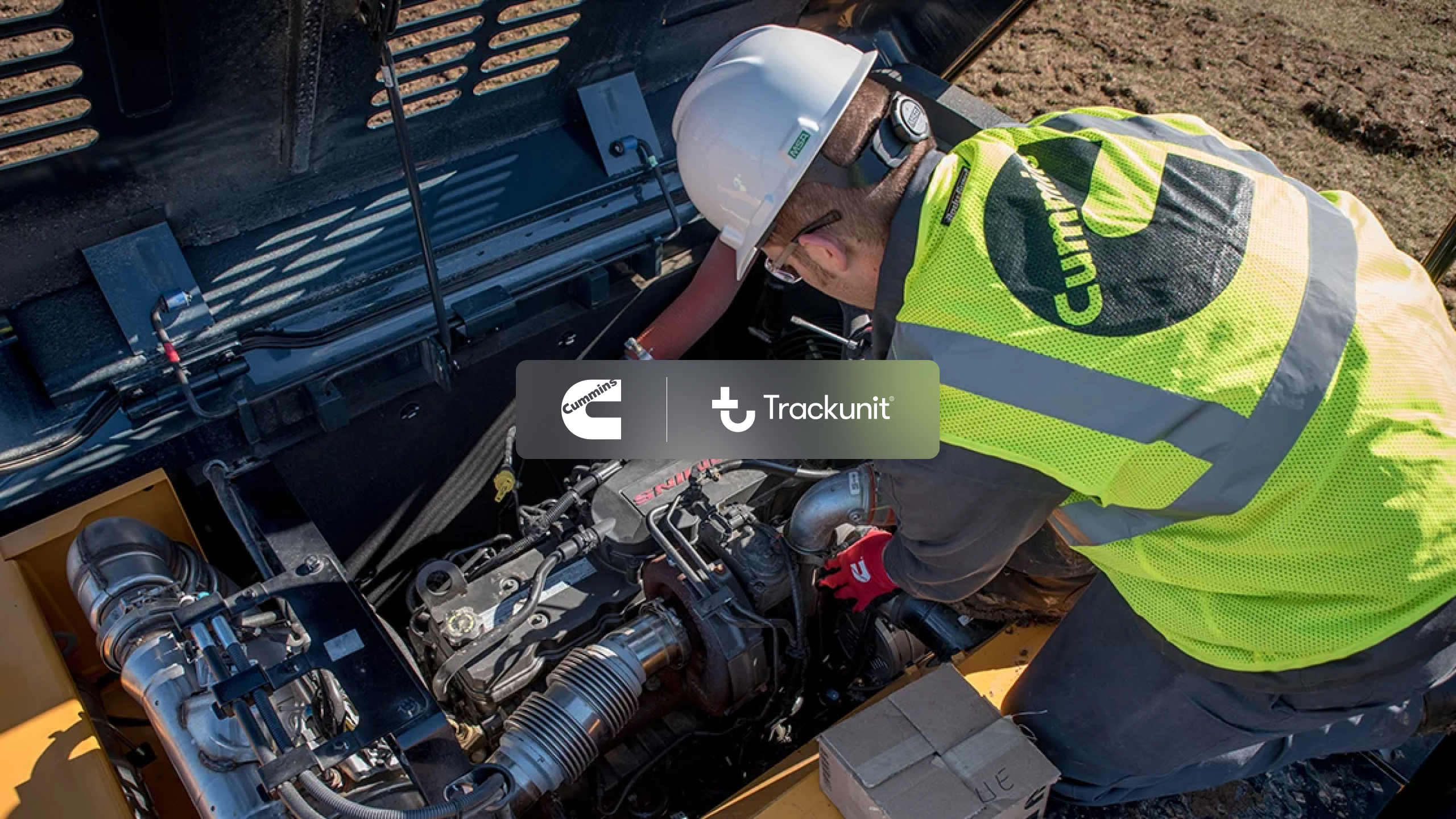 A worker in a safety vest and helmet repairs machinery outdoors, using advanced connectivity from IrisX. Cummins and Trackunit logos are displayed in the center.