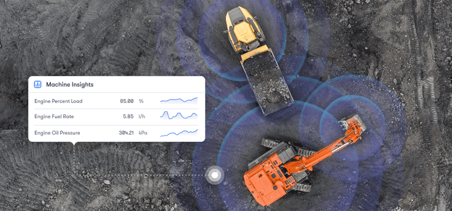 Aerial view of an excavator loading dirt into a dump truck, with digital overlays of machine data like engine load and fuel rate, illustrating construction equipment tracking.