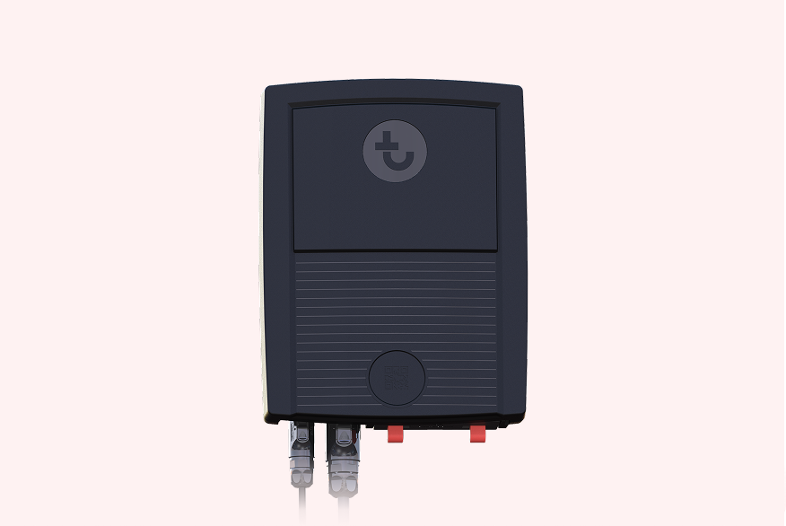 Black rectangular telematics device with a branded logo and two cables extending from the bottom.