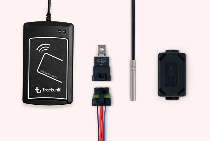 An RFID card reader, an electrical relay with a wiring harness, a temperature probe, and a small connector block for telematics equipment.