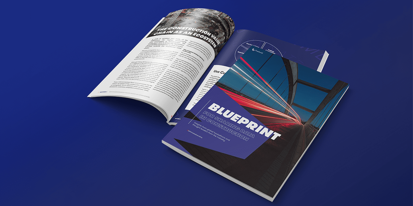 Open printed report titled Blueprint for Sharing Data in Construction on a blue background, illustrating how reducing downtime and maintaining a connected jobsite depends on trust.