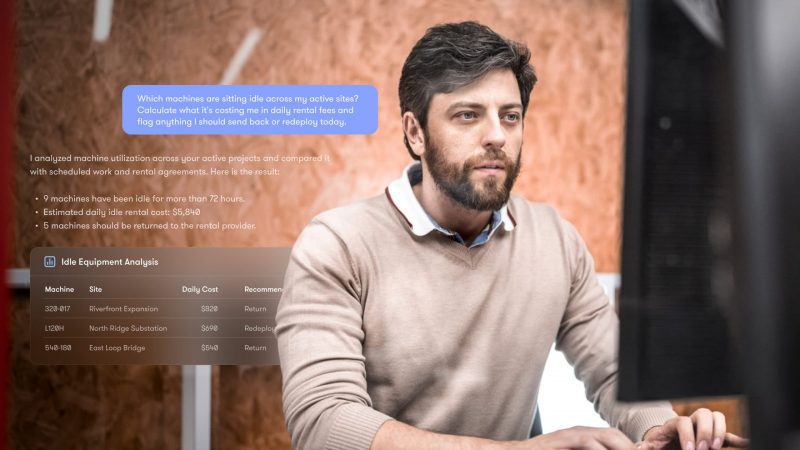 A man reviews an idle equipment analysis report on a computer screen, using MCP for construction fleet management.