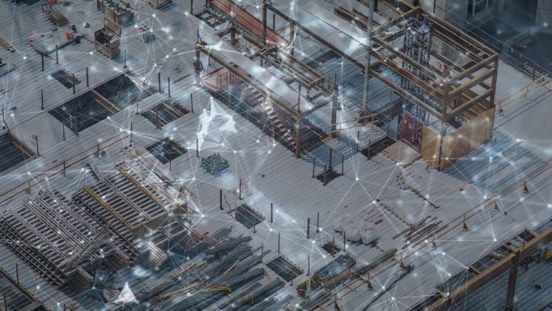 A construction site with steel beams and equipment, overlaid by a digital network pattern symbolizing a connected jobsite.