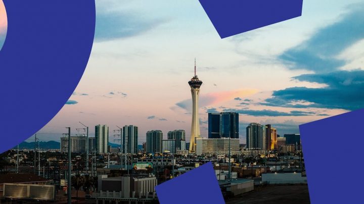 Las Vegas cityscape at dusk with the Stratosphere Tower, high-rises, and abstract blue data shapes, hinting at construction IoT.