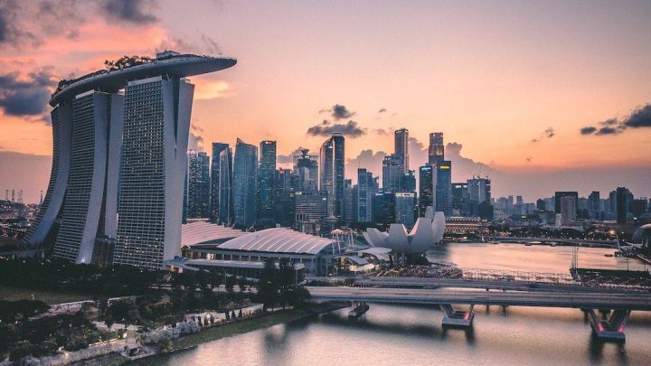 Singapore Marina Bay at sunset with Marina Bay Sands, ArtScience Museum, and modern skyline—highlighting connected jobsite progress.