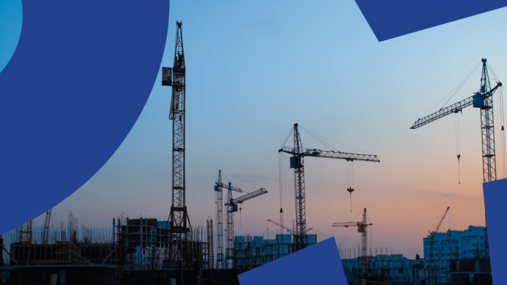 Silhouettes of cranes and buildings at sunset with blue graphic corners, suggesting diversity in a connected jobsite.