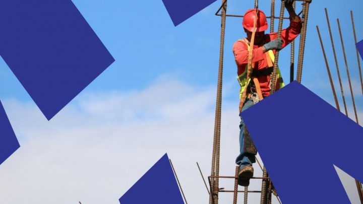 A construction worker in safety gear stands on steel rebar under a blue sky, with geometric shapes suggesting a connected jobsite.