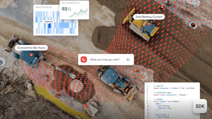 Aerial view of three construction vehicles on a dirt site with digital overlays, representing telematics in construction.