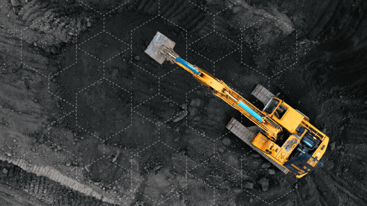 A yellow excavator digs in a hexagonal grid-marked area, guided by MCP AI for connected jobsite efficiency, viewed from above.