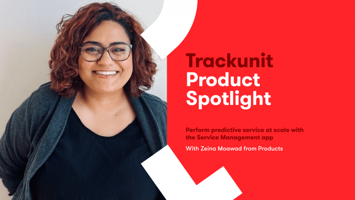 Smiling person with curly hair and glasses stands beside a red Trackunit Product Spotlight banner featuring predictive service in construction IoT.