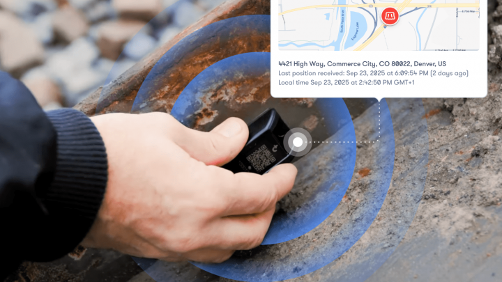 A hand places a small black GPS tracker on rusty metal. An inset map shows diagnostics and tracking at a McDonalds in Denver—fleet management.