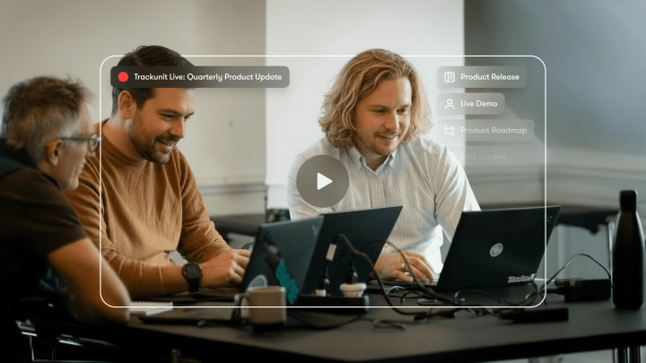 Three people work together on laptops with a paused Trackunit Live webinar about product updates, related to construction IoT.