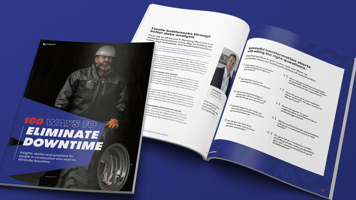 Two open magazines on a blue surface; cover shows a worker in safety gear and productivity tips, with content on connected jobsite.